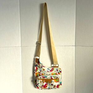 Lily Bloom crossbody bag, colorful bird pattern.